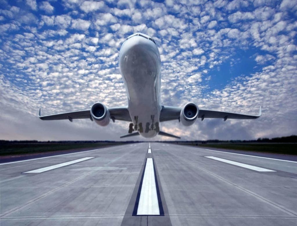 Commercial aircraft taking off of runway