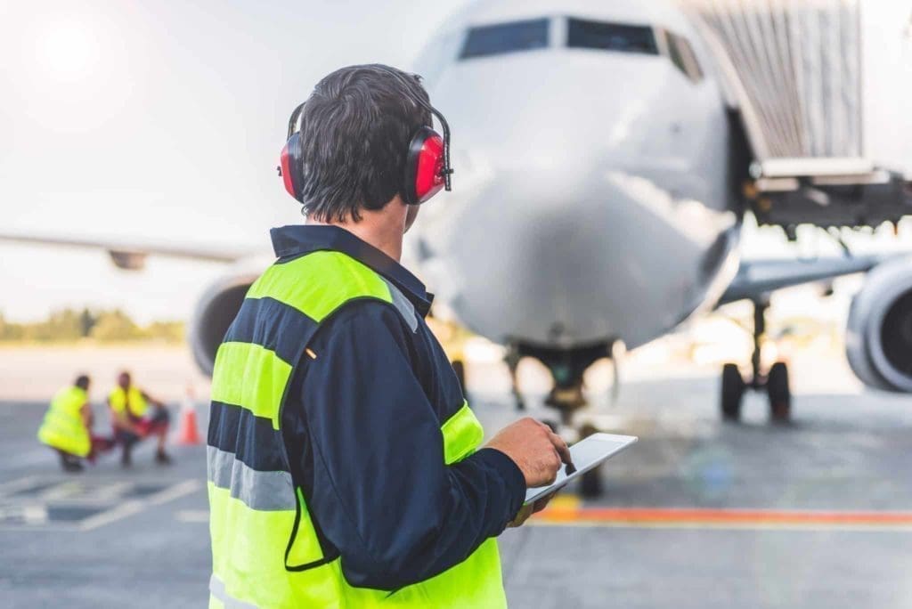 Aviation technician reviewing tablet