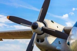 Close up of propeller of an aircraft being inspected for corrosion.